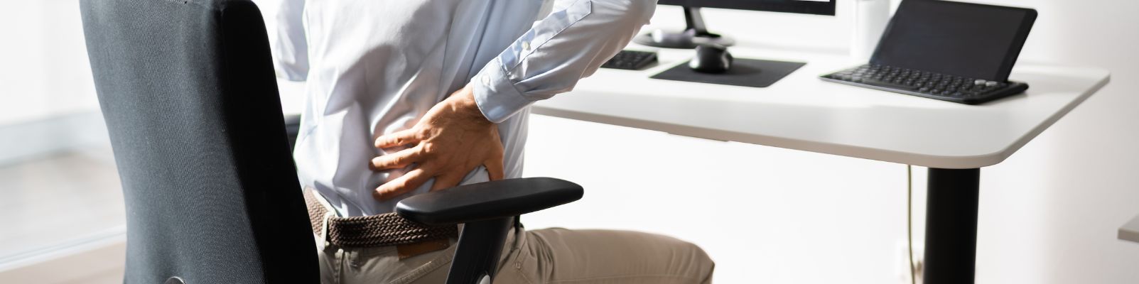 Sitting at a desk for long periods of time may cause Sciatic pain